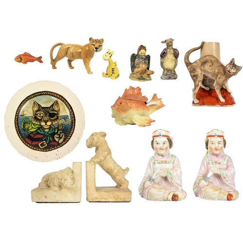 499 - A pair of late 19th/early 20th century continental pottery figures of seated ladies holding fans. He... 