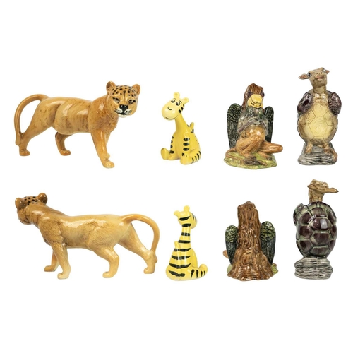 499 - A pair of late 19th/early 20th century continental pottery figures of seated ladies holding fans. He... 