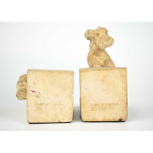 499 - A pair of late 19th/early 20th century continental pottery figures of seated ladies holding fans. He... 