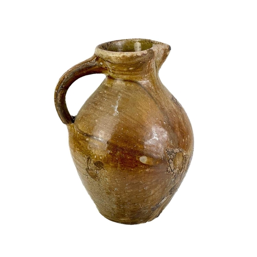 501 - A 20th century stoneware ewer of large proportions. Unsigned. Height 39cm, together with a 19th cent... 