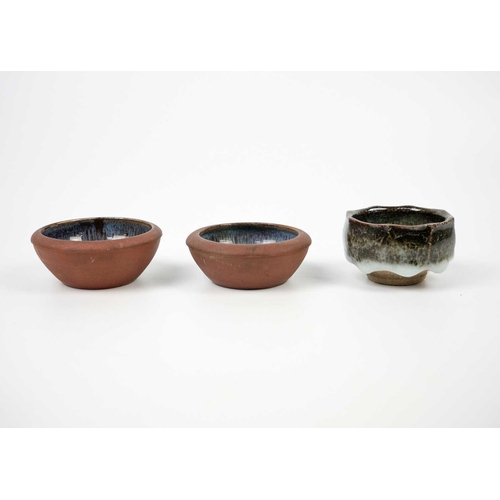 505 - Humfrey Wakefield, Isles of Scilly Pottery. A green-glaze vase and two bowls each marked to the base... 