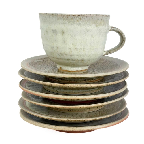 507 - A Studio pottery teaset. Comprising six cups and saucers, a sugar bowl, and a milk jug, together wit... 