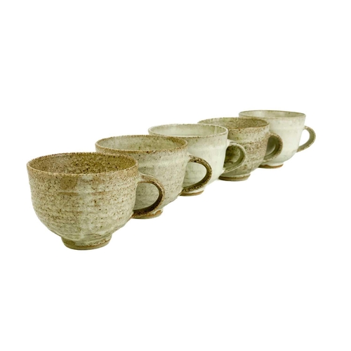 507 - A Studio pottery teaset. Comprising six cups and saucers, a sugar bowl, and a milk jug, together wit... 
