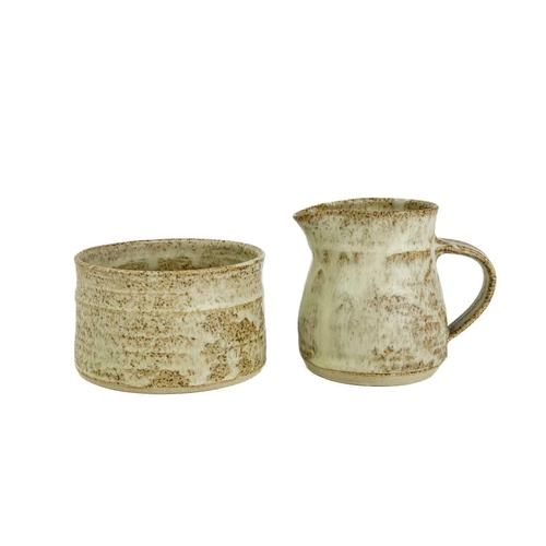 507 - A Studio pottery teaset. Comprising six cups and saucers, a sugar bowl, and a milk jug, together wit... 