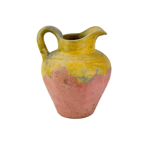 516 - A large pottery jug. Height 32cm together with two other pottery jugs and a large studio pottery dis... 