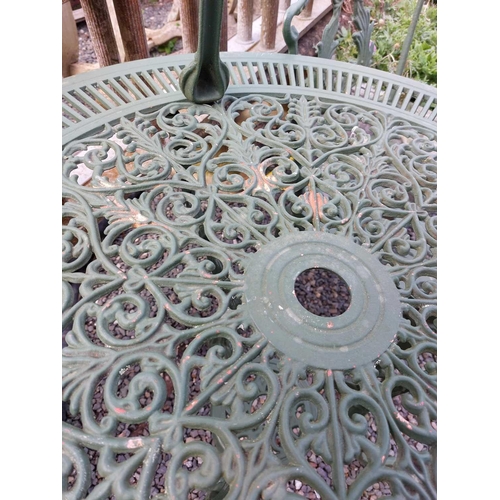 518 - A green painted metal bistro set. Comprising a circular table, height 68.5cm, diameter 80cm, and fou... 
