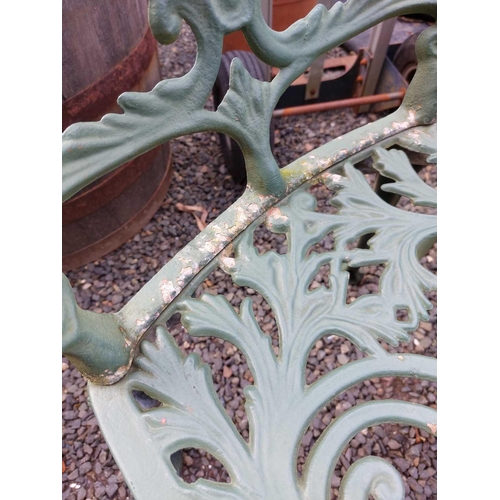 518 - A green painted metal bistro set. Comprising a circular table, height 68.5cm, diameter 80cm, and fou... 