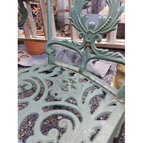 518 - A green painted metal bistro set. Comprising a circular table, height 68.5cm, diameter 80cm, and fou... 