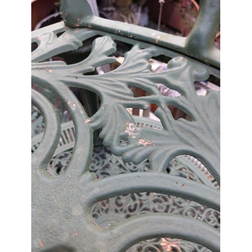 518 - A green painted metal bistro set. Comprising a circular table, height 68.5cm, diameter 80cm, and fou... 