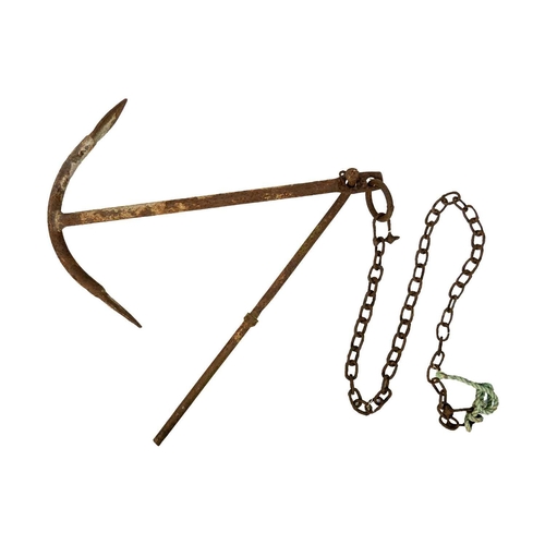 521 - A wrought iron ship's anchor. With chain, height 82cm, width 57cm.