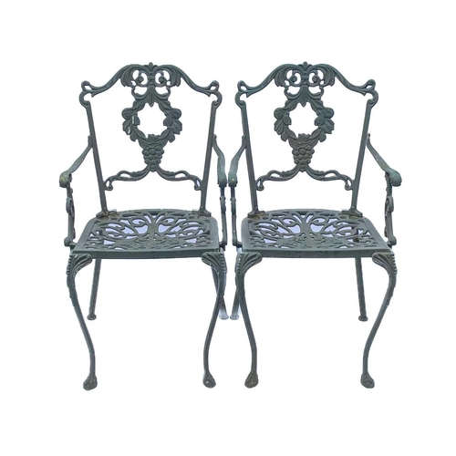 522 - A green painted metal bistro set. Comprising a circular table, height 68.5cm, diameter 80cm, and fou... 