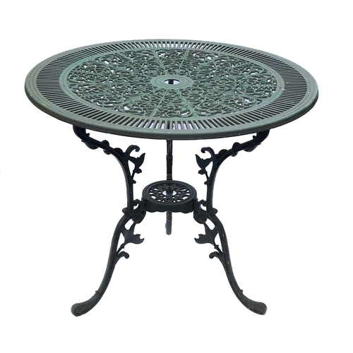 522 - A green painted metal bistro set. Comprising a circular table, height 68.5cm, diameter 80cm, and fou... 