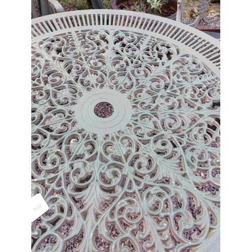 522 - A green painted metal bistro set. Comprising a circular table, height 68.5cm, diameter 80cm, and fou... 