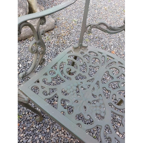 522 - A green painted metal bistro set. Comprising a circular table, height 68.5cm, diameter 80cm, and fou... 