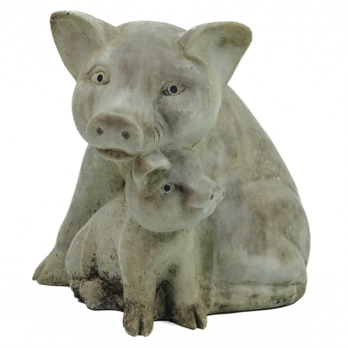 526 - A reconstituted stone group of pigs. Height 41cm, width 37cm, depth 45cm.