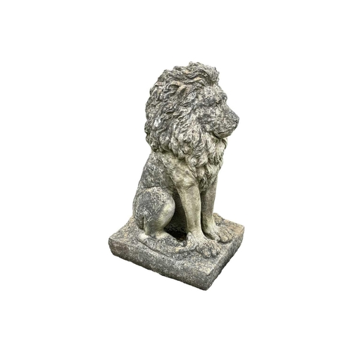 528 - A cast reconstituted stone statue of a seated lion. Raised on square base. Height 85cm.