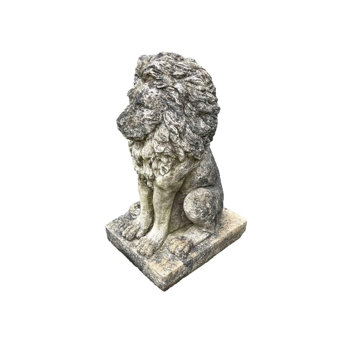 528 - A cast reconstituted stone statue of a seated lion. Raised on square base. Height 85cm.