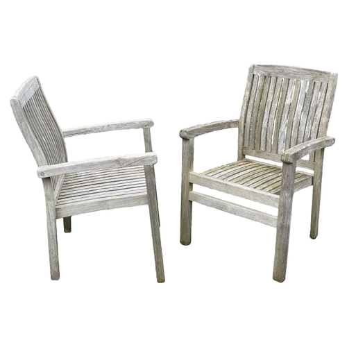 533 - A large circular weathered teak garden table. With polished granite Lazy Susan, diameter of top 180c... 