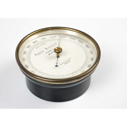 538 - A Short & Mason Mark 2 Ministry aneroid barometer. Diameter 13.5cm, together with an Italian globe l... 