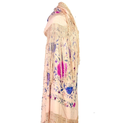 101 - A Chinese silk embroidered light pink shawl, 20th century. With polychrome embroidery and tasselled ... 