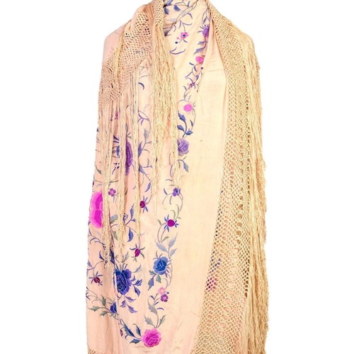 101 - A Chinese silk embroidered light pink shawl, 20th century. With polychrome embroidery and tasselled ... 