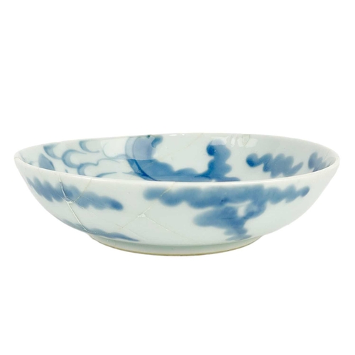 120 - A Chinese provincial blue and white bowl. Height 6cm, diameter 14cm, two Chinese blue and white drag... 