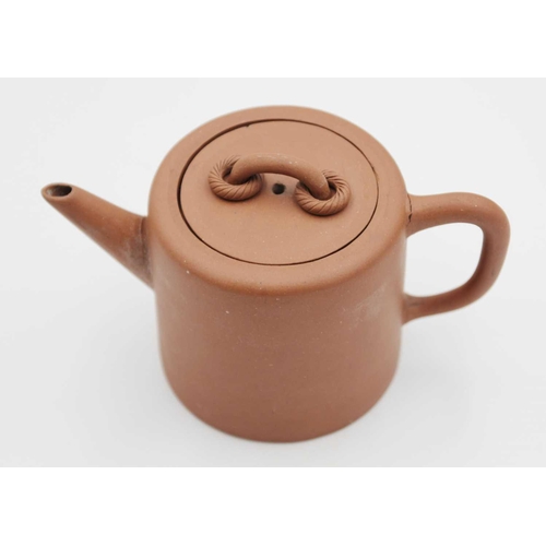 122 - A Chinese Yixing teapot. Seal mark, height 11cm, width 17cm, diameter 9.5cm.