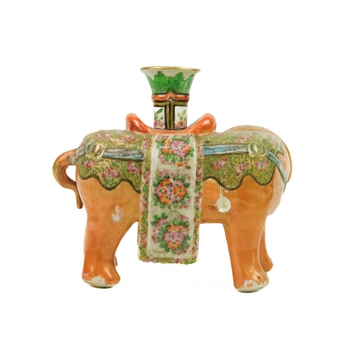 125 - A Chinese Canton famille rose 'elephant' candlestick, Qing Dynasty, 19th century. With a vase-shaped... 