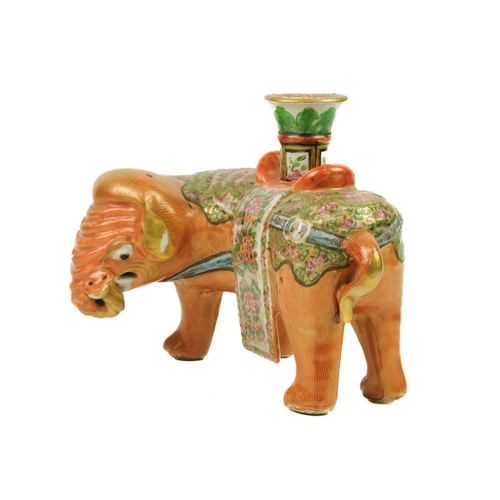 125 - A Chinese Canton famille rose 'elephant' candlestick, Qing Dynasty, 19th century. With a vase-shaped... 