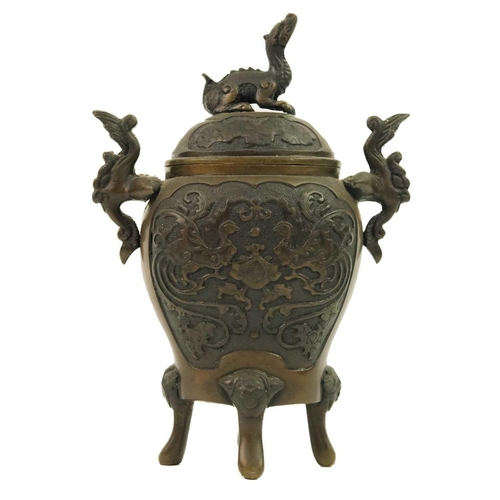 127 - A Chinese bronze incense burner, Qing Dynasty, 19th century. The cover surmounted by a dragon, the b... 