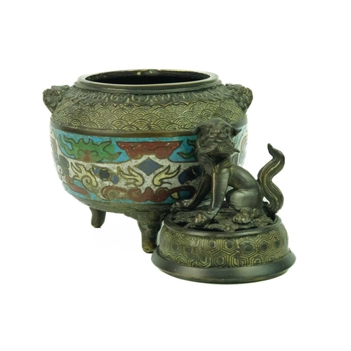 128 - A Chinese bronze and champleve incense burner, Qing Dynasty, 19th century. The pierced cover surmoun... 