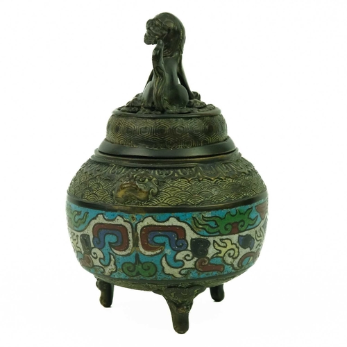 128 - A Chinese bronze and champleve incense burner, Qing Dynasty, 19th century. The pierced cover surmoun... 