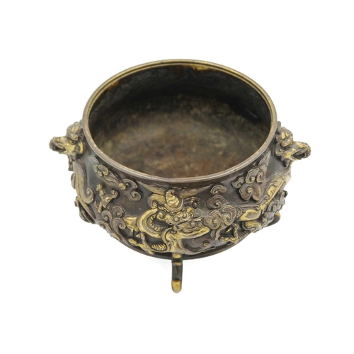 13 - A Chinese gilt bronze censer and cover, late Ming Dynasty. Xuande mark, with elephant mask handles, ... 