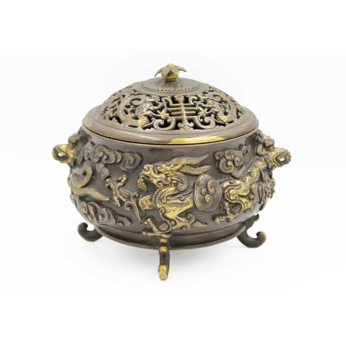 13 - A Chinese gilt bronze censer and cover, late Ming Dynasty. Xuande mark, with elephant mask handles, ... 