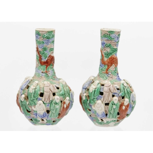 133 - A pair of Chinese famille verte reticulated bottle vases, Qing Dynasty, 19th century. The body mould... 