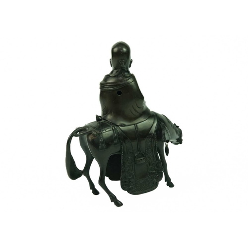 136 - A Chinese bronze incense burner, Qing Dynasty, 19th century. The immortal seated on horseback, heigh... 