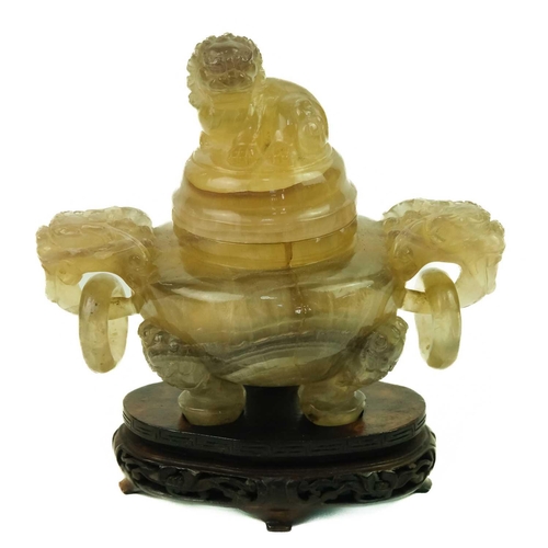 137 - A Chinese agate incense burner on stand, late Qing Dynasty.. The cover surmounted with a dog of fo a... 