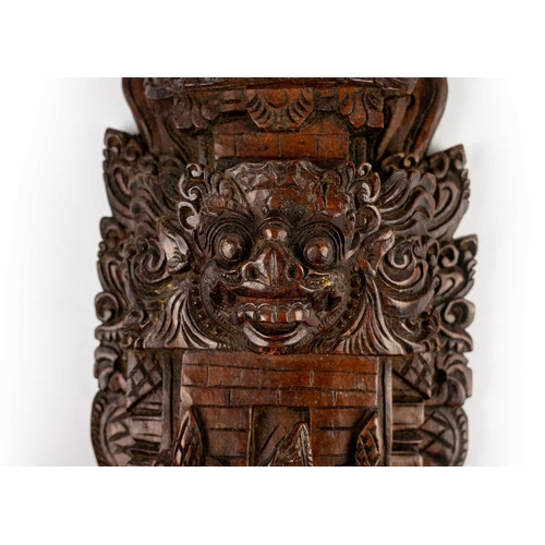 140 - Two Balinese hardwood carvings, mid 20th century. Each depicting a tower with a female figure in the... 