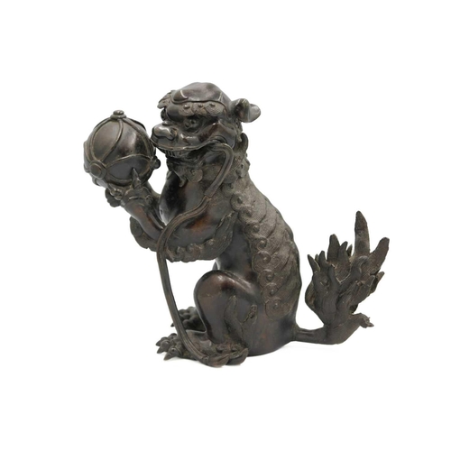 141 - A Chinese bronze 'lion dog' incense burner, Qing Dynasty, 19th century. With detachable head, the pa... 