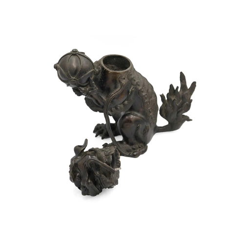 141 - A Chinese bronze 'lion dog' incense burner, Qing Dynasty, 19th century. With detachable head, the pa... 