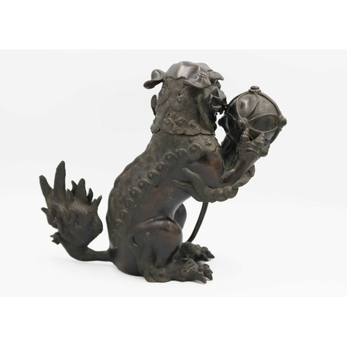 141 - A Chinese bronze 'lion dog' incense burner, Qing Dynasty, 19th century. With detachable head, the pa... 