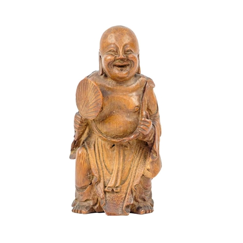 144 - A Chinese boxwood figure of Buddha, Qing Dynasty, late 19th century. Height 11.5cm, width 6cm, depth... 