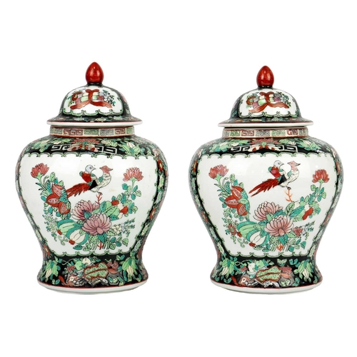 146 - A pair of Chinese famille noire baluster vases, early-mid 20th century. Red seal mark and old paper ... 