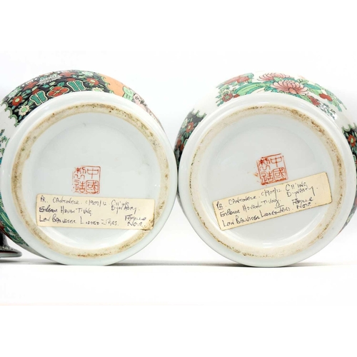 146 - A pair of Chinese famille noire baluster vases, early-mid 20th century. Red seal mark and old paper ... 