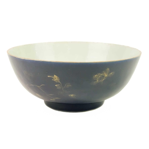 164 - A Chinese blue-ground porcelain punch bowl, Qianlong period. Painted to the exterior in gilding with... 