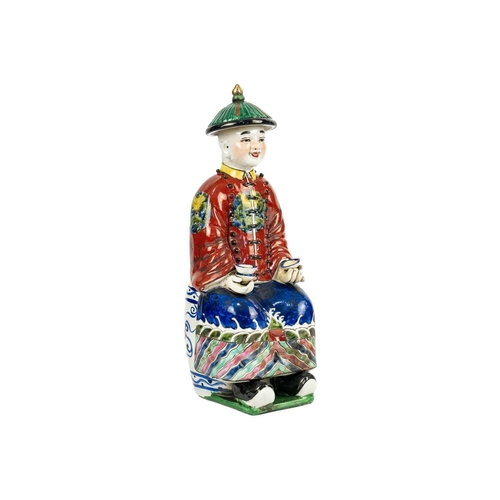 175 - A Chinese porcelain figure of a seated Emperor, 20th century. Two seal marks to base, height 27cm, w... 