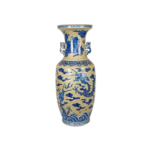 18 - A large Chinese floor standing baluster 'dragon' vase, late 19th century. With a pair of chilong han... 