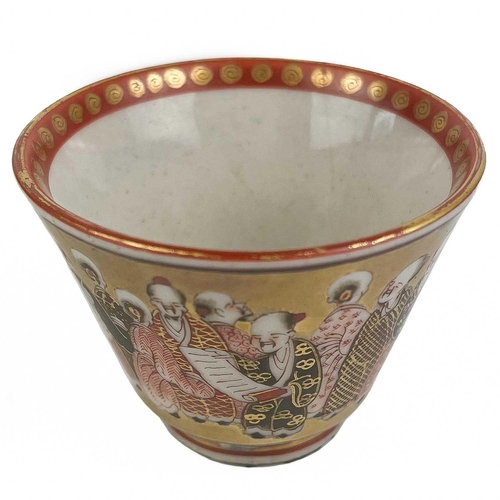 187 - A Japanese Satsuma porcelain tea bowl, 19th century. Signed, the gilt exterior decorated with multip... 