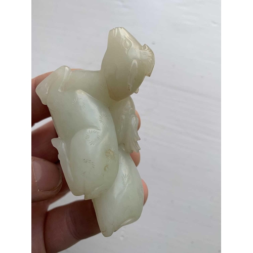 2 - A Chinese carved celadon jade group of deers, Qing Dynasty, 19th century. Height 4.8cm, width 7cm, d... 