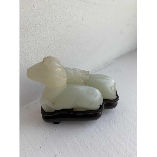 2 - A Chinese carved celadon jade group of deers, Qing Dynasty, 19th century. Height 4.8cm, width 7cm, d... 